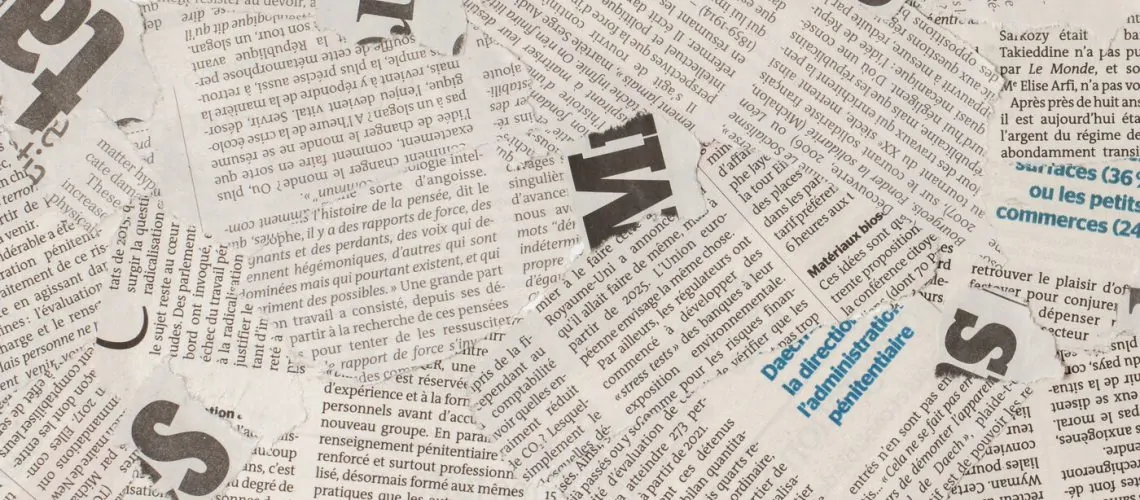 rsz_1top-view-old-french-newspaper-pieces